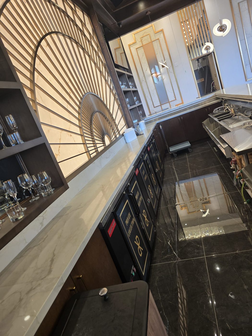 Custom-fabricated A3 cocktail station with integrated Newair refrigeration.